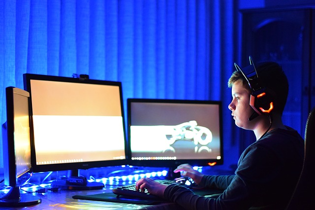 Child playing games using a dock on his PC