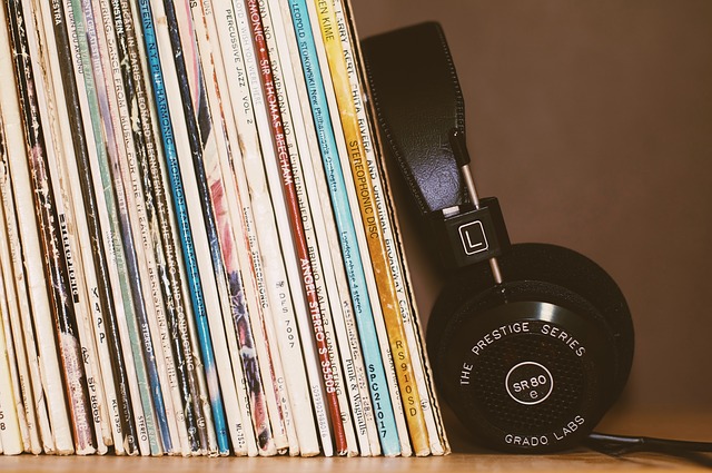 Headphones leaning on vinyl records