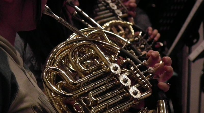 A band playing French horns