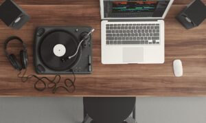 Turntable sitting next to computer